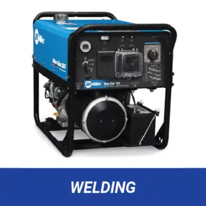 A Miller Blue Star 185 welding generator with a blue top cover and black frame, featuring a control panel with various dials, switches, and a clear protective cover over an outlet. A black battery and a circular black engine component are visible below the control panel. The text "WELDING" appears on a blue bar at the bottom.